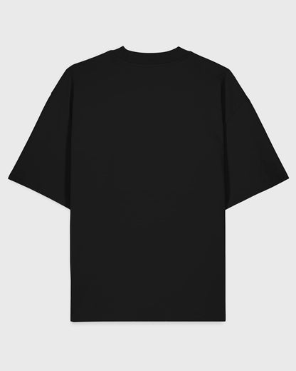 Flatlay-Rückansicht des Stanley/Stella Blaster 2.0 Unisex T-Shirts in Schwarz – nachhaltige Bio-Streetwear von Natura Umbra.