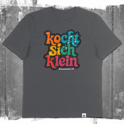 Nachhaltiges Unisex T-Shirt von Natura Umbra in Anthrazit mit Frontprint „Kocht sich klein“ – Flatlay des Stanley/Stella Creator 2.0.